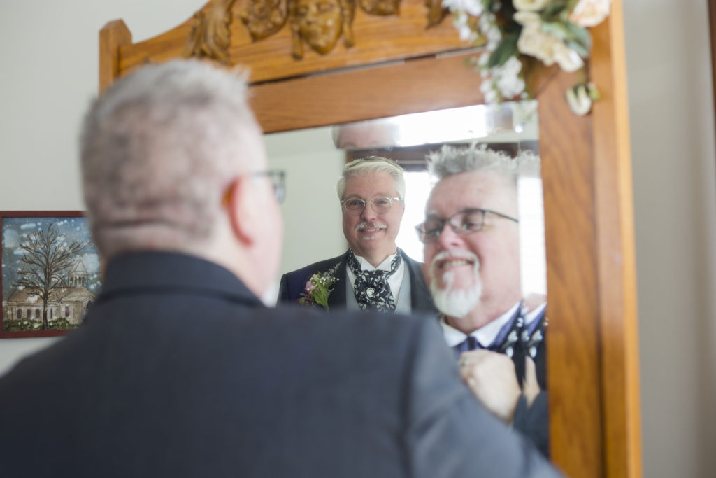 Michigan grooms in the mirror