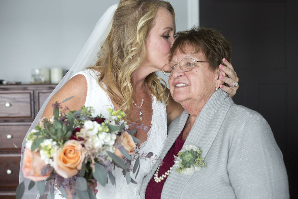 Chelsea bride kisses mom's forehead