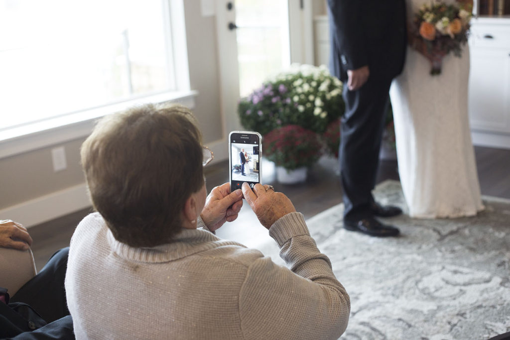 Mom takes photo of her daughter during their wedding