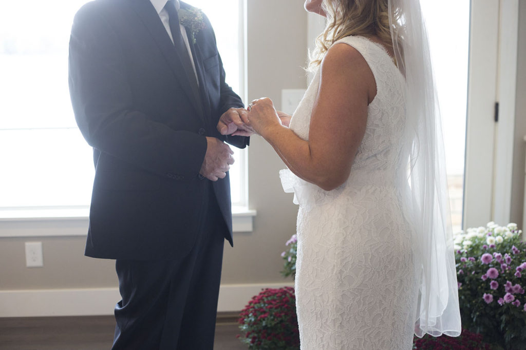 Couple holds hands during their elopement