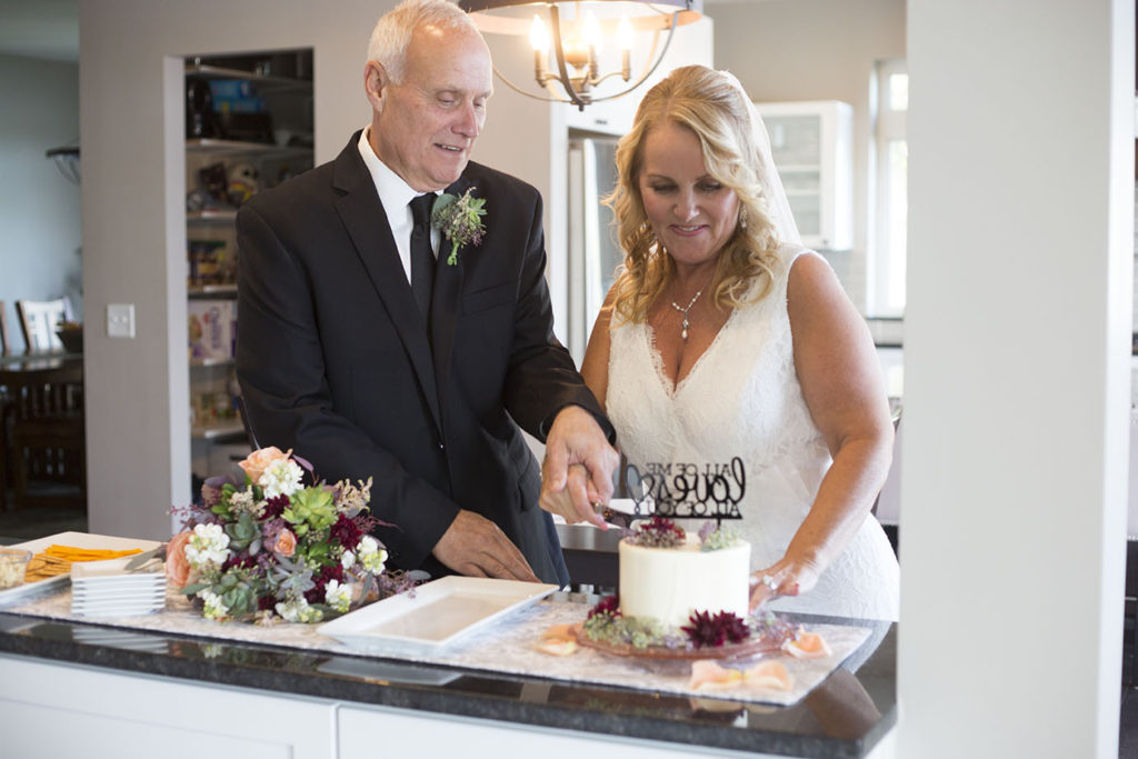 Cutting of the cake after their Chelsea Michigan elopement