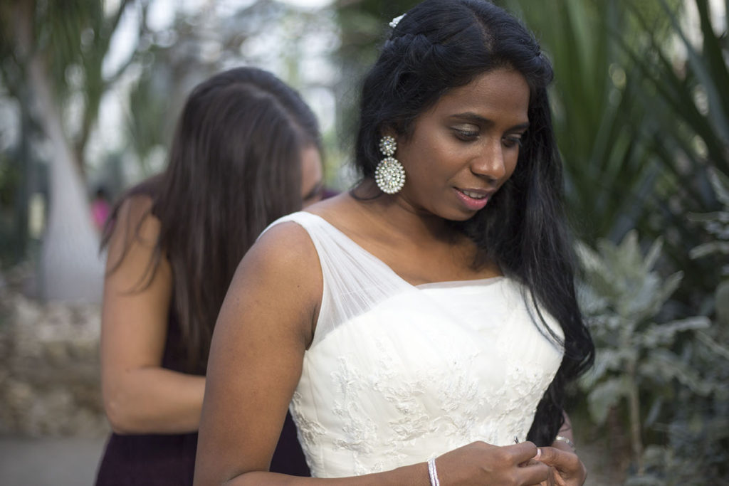 Lavender putting on the finishing touches before she walks down the aisle for her Belle Isle wedding