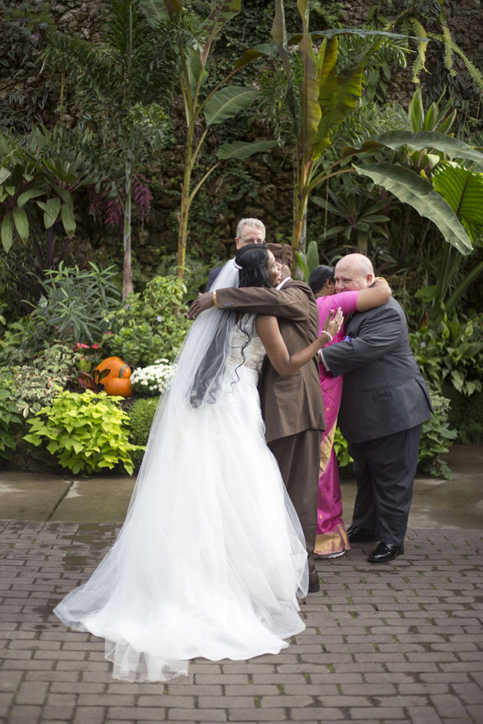 Parents giving away their daughter at their Detroit wedding