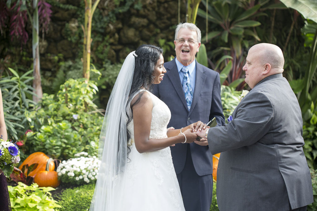 Officiant sharing some laughs during the Belle Isle wedding ceremony