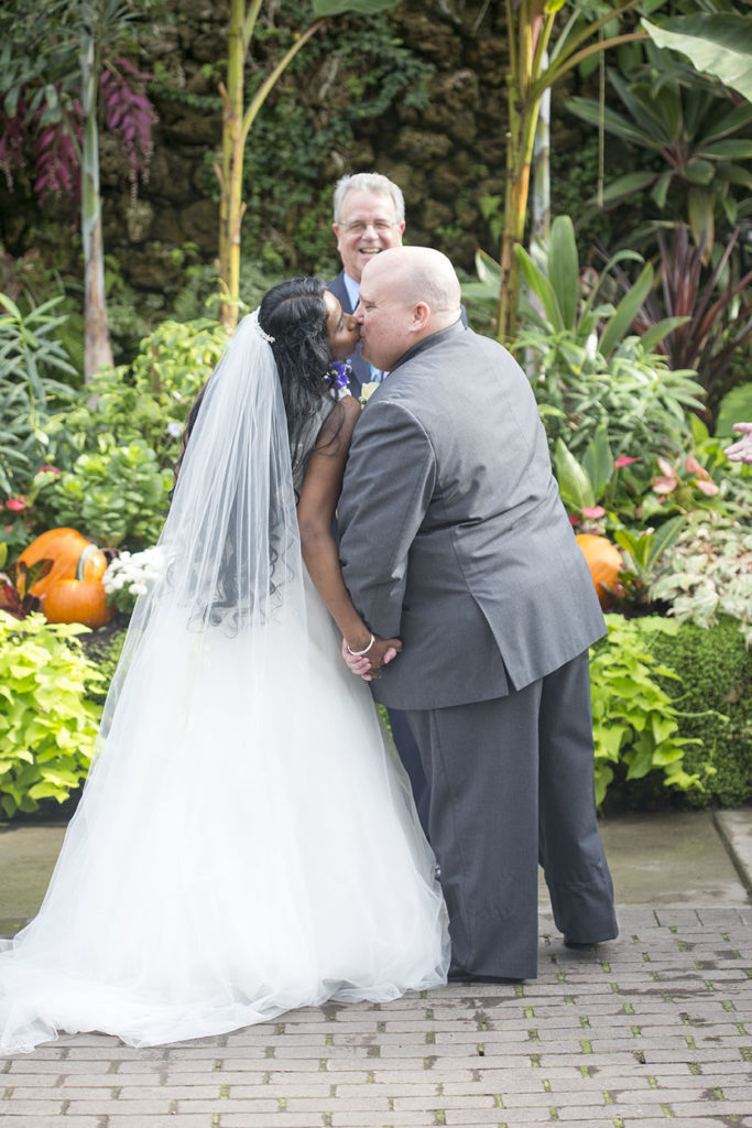 First kiss between husband and wife at their Belle Isle wedding