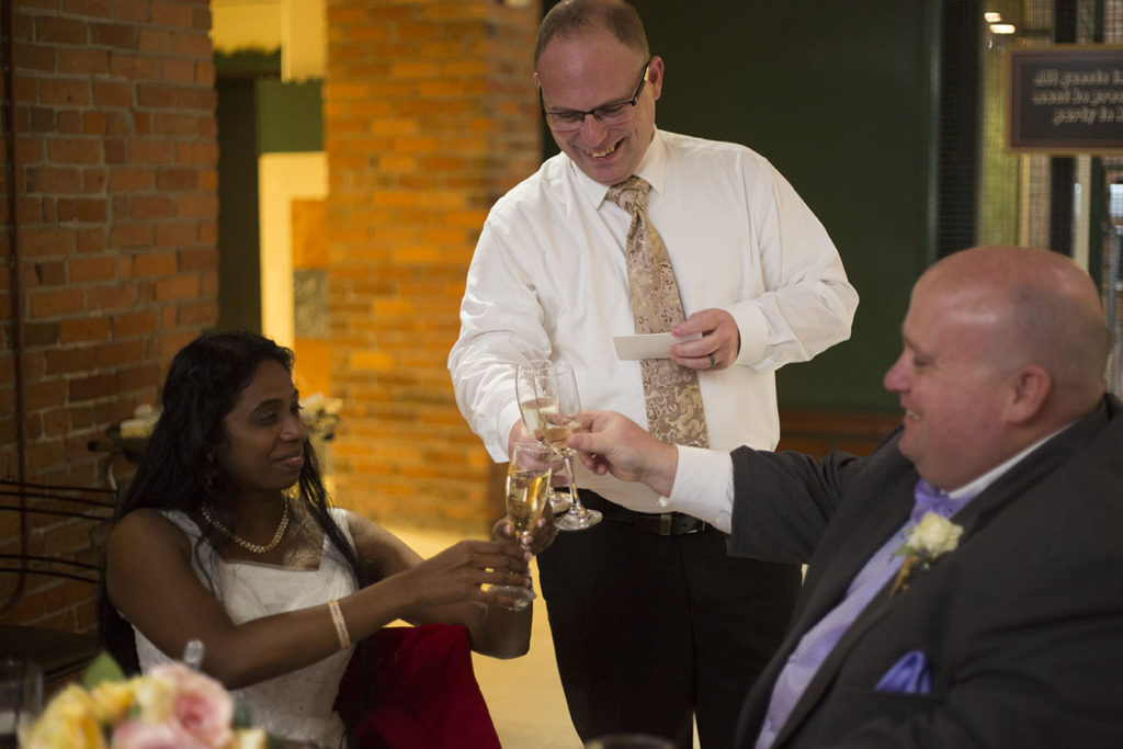 Bride and groom toasts the best man