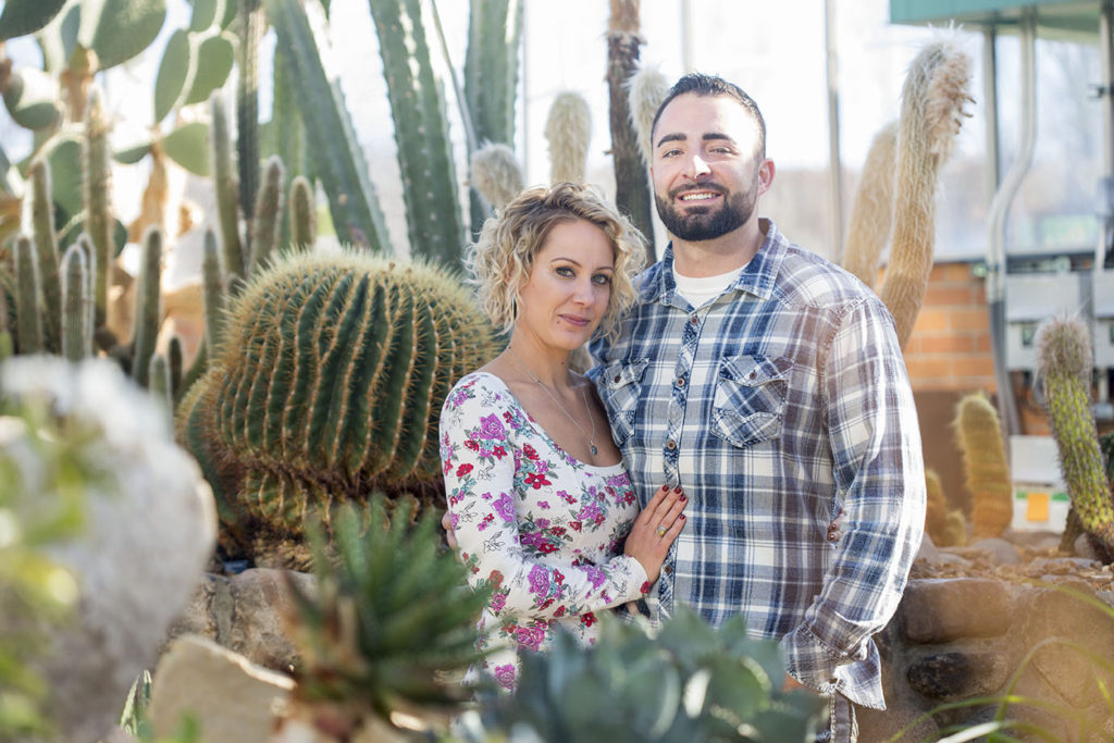 Clint and Meggie cuddle among the cactuses at Matthaei Botanical Gardens