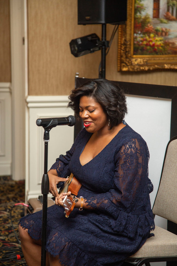 Taylor Boykins singing at Novi wedding