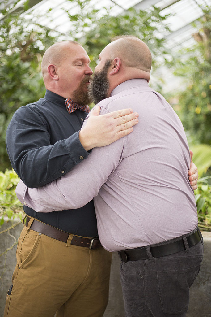 First kiss between gay men at their Michigan micro wedding