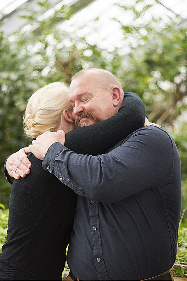 Wedding party hugs after ceremony