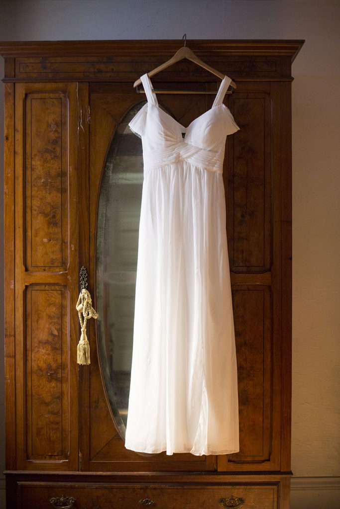 Wedding dress hangs on a wardrobe at Celebrations Wedding Chapel