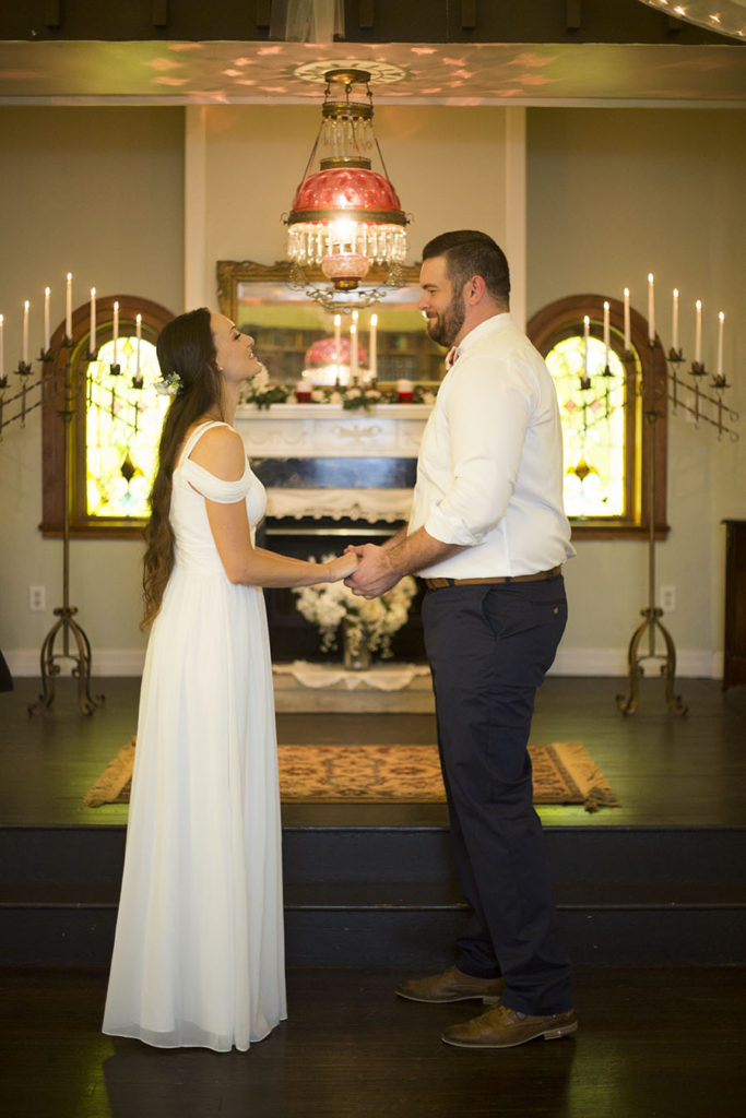 The couple standing at the altar in Celebrations Wedding Chapel