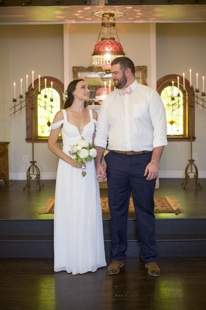 Couple looks at each other with hearts filled after their wedding