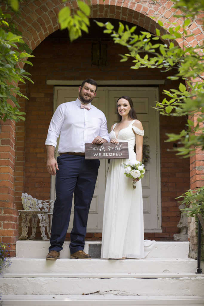 Couple on steps of Celebrations Wedding Chapel