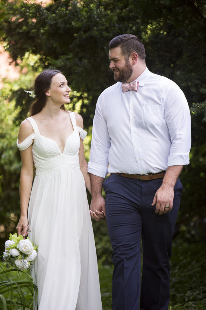 Couple walking in the gardens of Celebrations Wedding Chapel