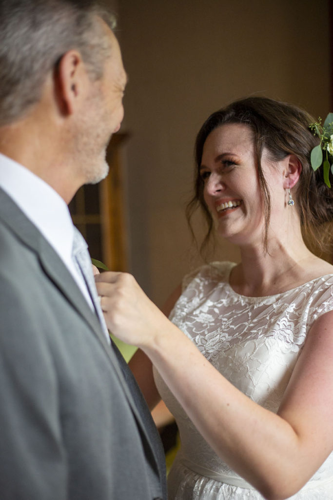 Rachel smiling at her dad before her Northville wedding