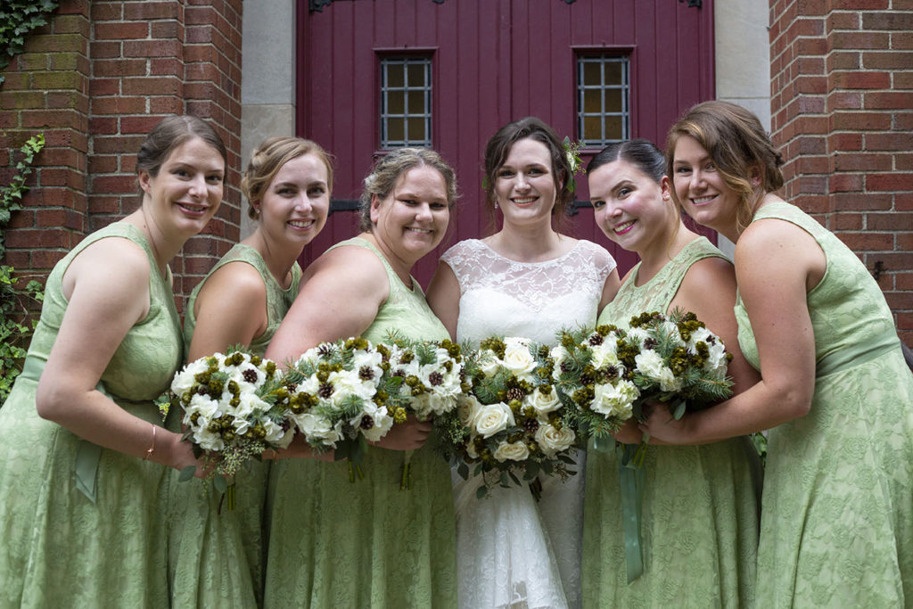 Bridesmaids outside of Lutheran church in Northville