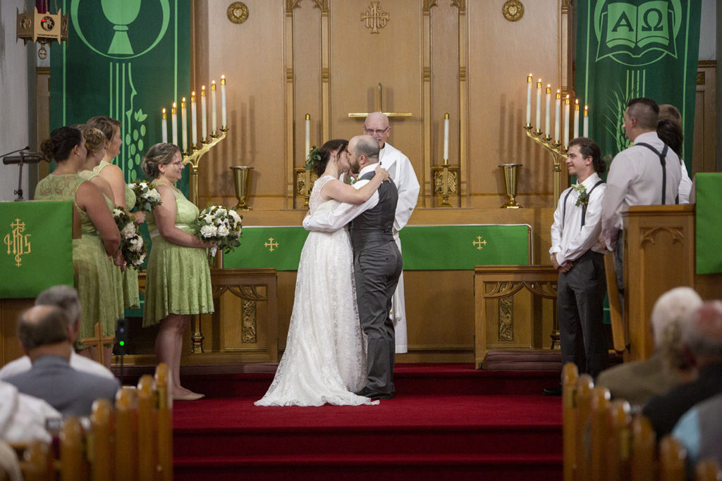 First kiss at their Northville wedding