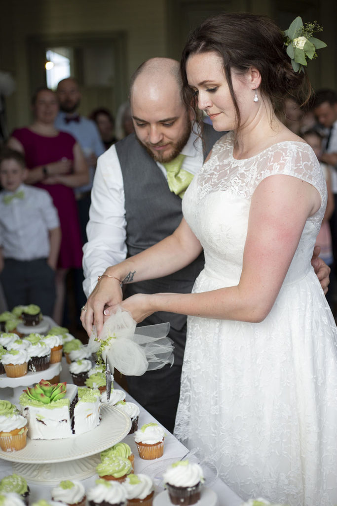 Cutting the cake at their Chelsea wedding