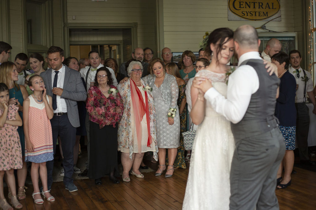 Mother and grandmother watch son's first dance as a married man