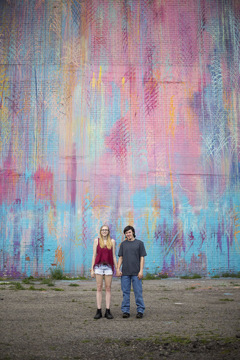 Michigan engaged couple in front of Detroit mural