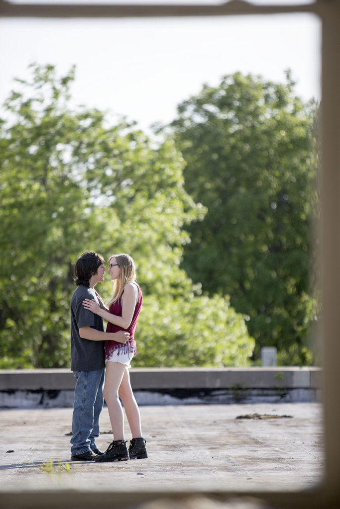 Michigan couple embraces during their engagement session