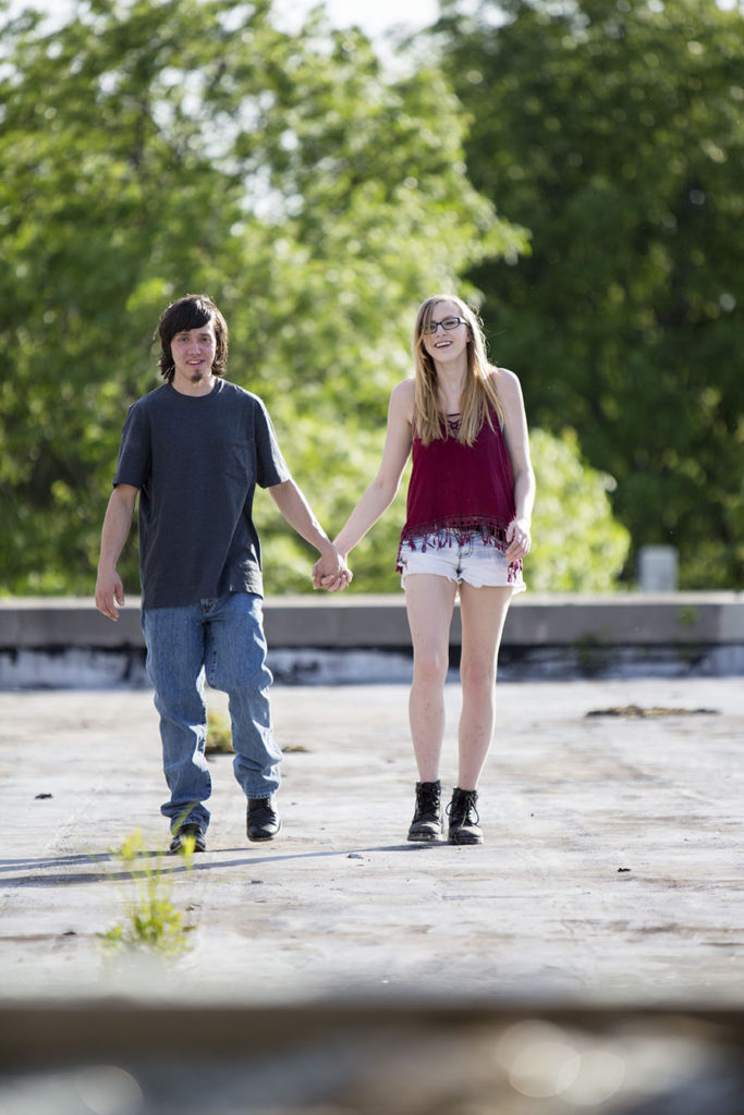 Brandon and Claire walking hand in hand