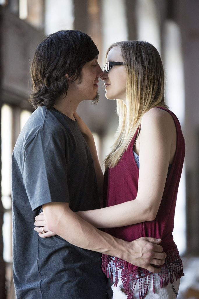 Brandon and Claire kissing in abandoned Catholic school in Detroit