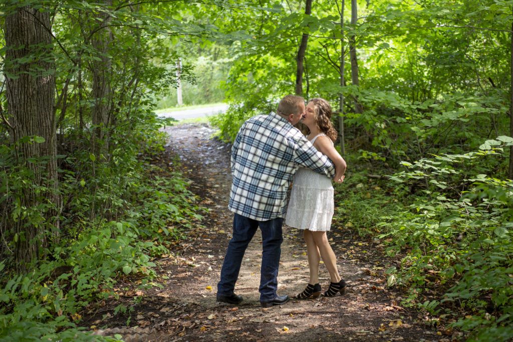 Chris and Lola kiss on the path