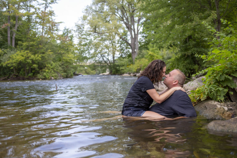 Wide angle of the Huron River and the Michigan engaged couple - how to stay cool during your photo session