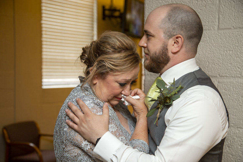 Groom's mother cries as she sees her son for the first time on his wedding day