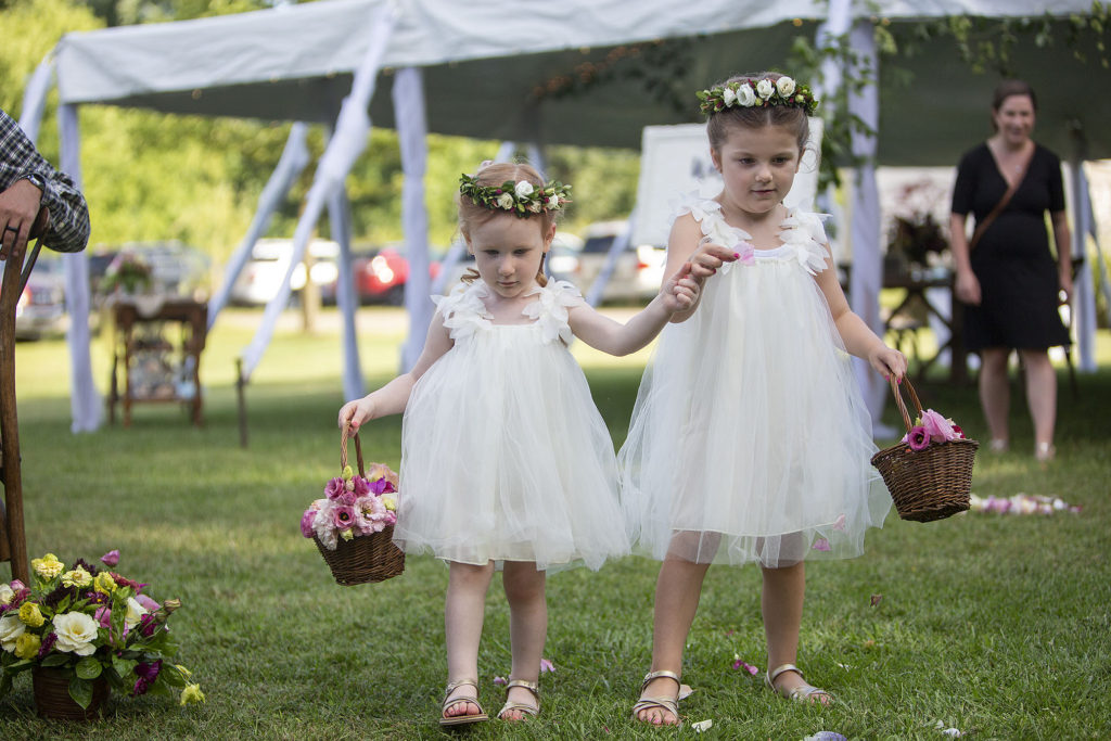 Flower girls walking down the aisle at Belleville wedding