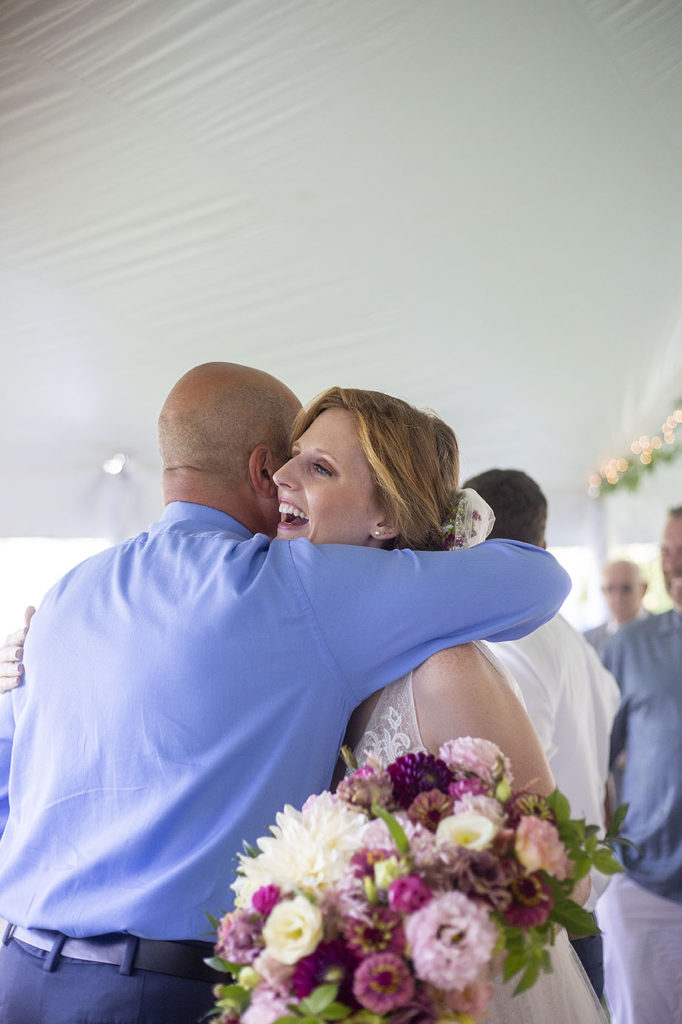 Bride hugs wedding guest