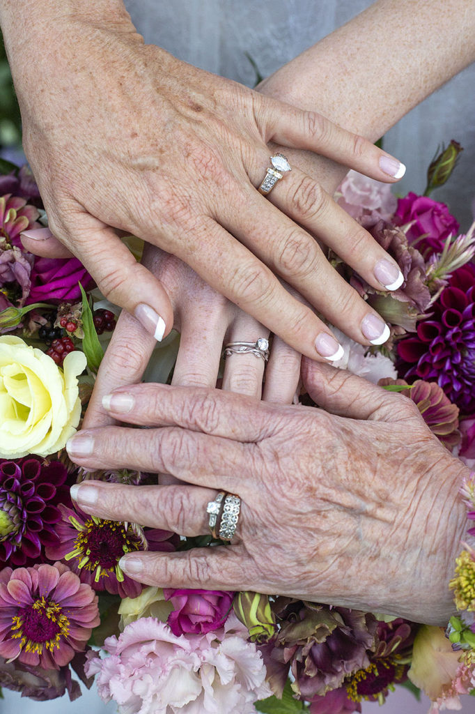 Three generations of women with their wedding rings. Grandma, mom, and daughter.