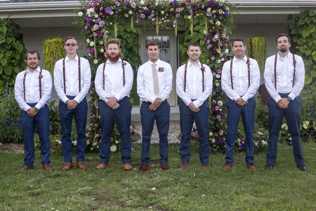 Groomsmen with navy pants and suspenders