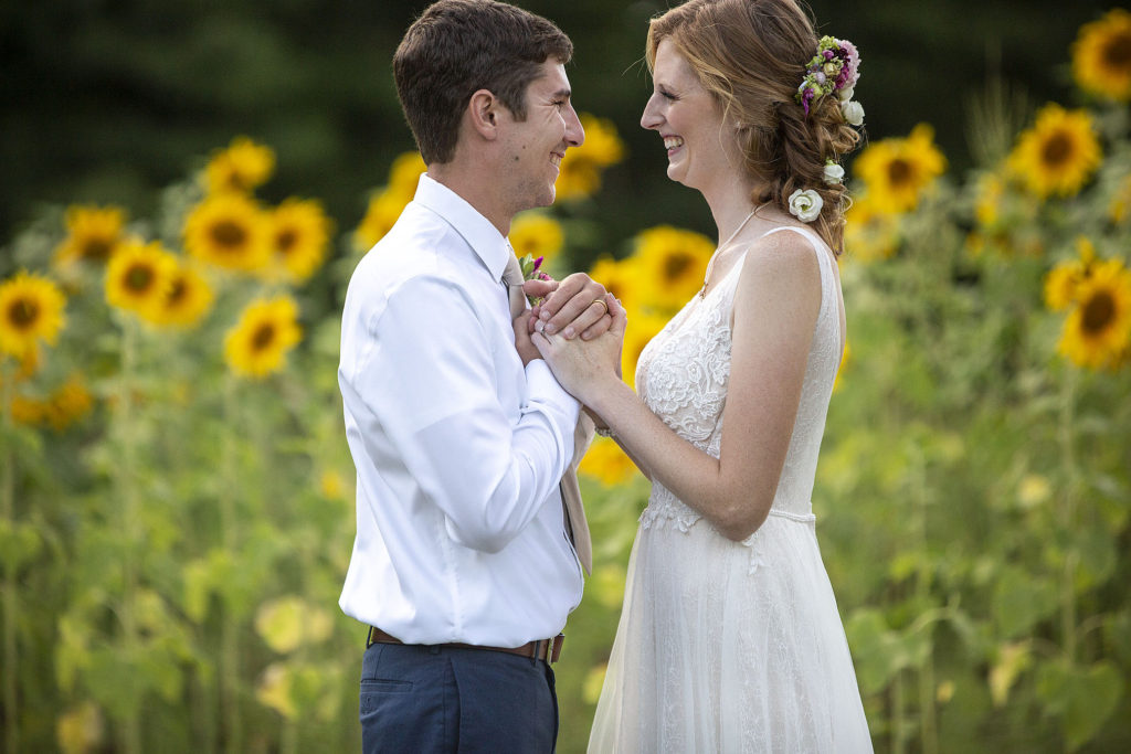 Bride and groom smile at each other