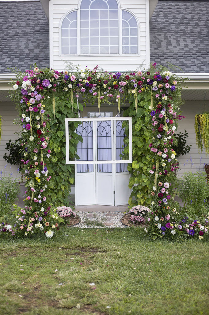 Photo backdrop set up after the ceremony at their Belleville wedding