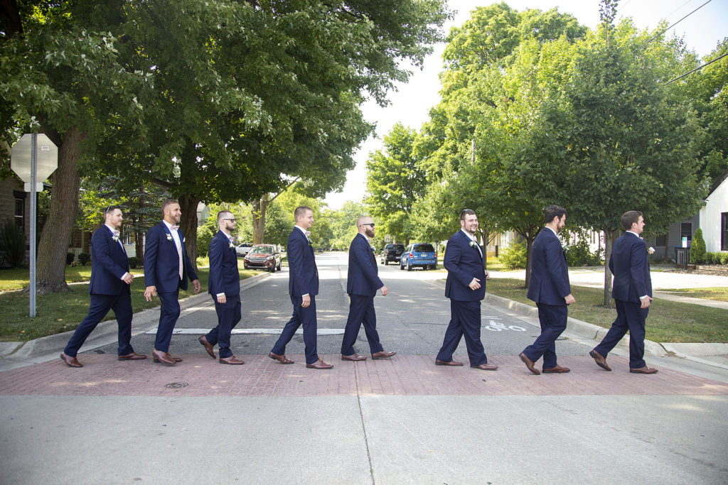 Recreating famous Beatles album cover downtown Howell