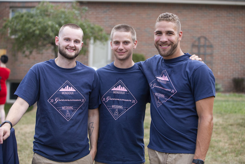 Groomsmen pose for a photo