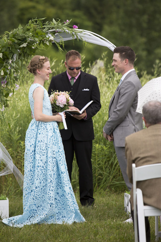 Ypsilanti wedding couple smile at each other