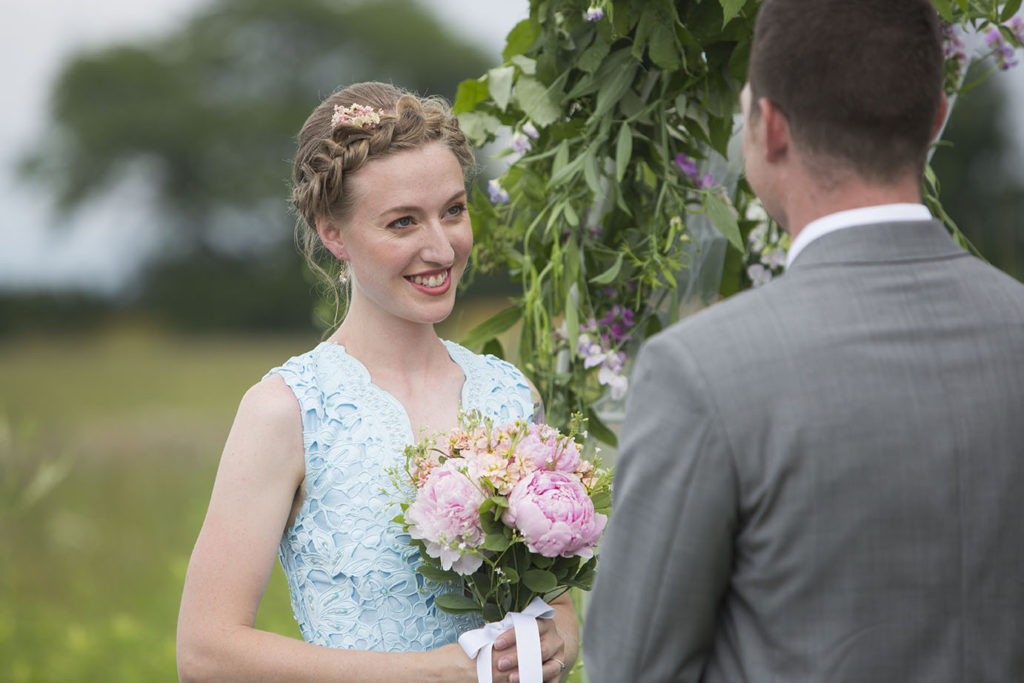 Rachel smiles at Wade as they become husband and wife