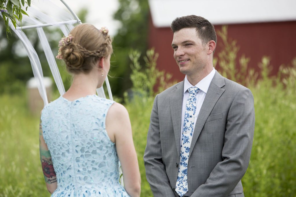 Wade looks at Rachel during their Ypsilanti wedding