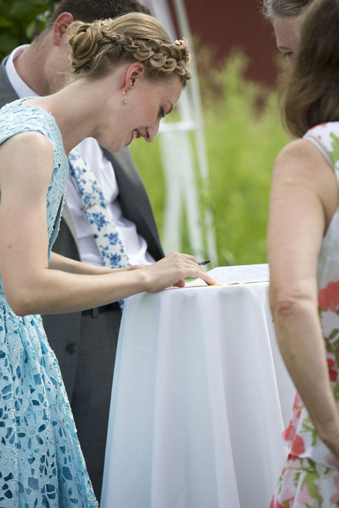 Signing of the marriage license after Ypsilanti wedding