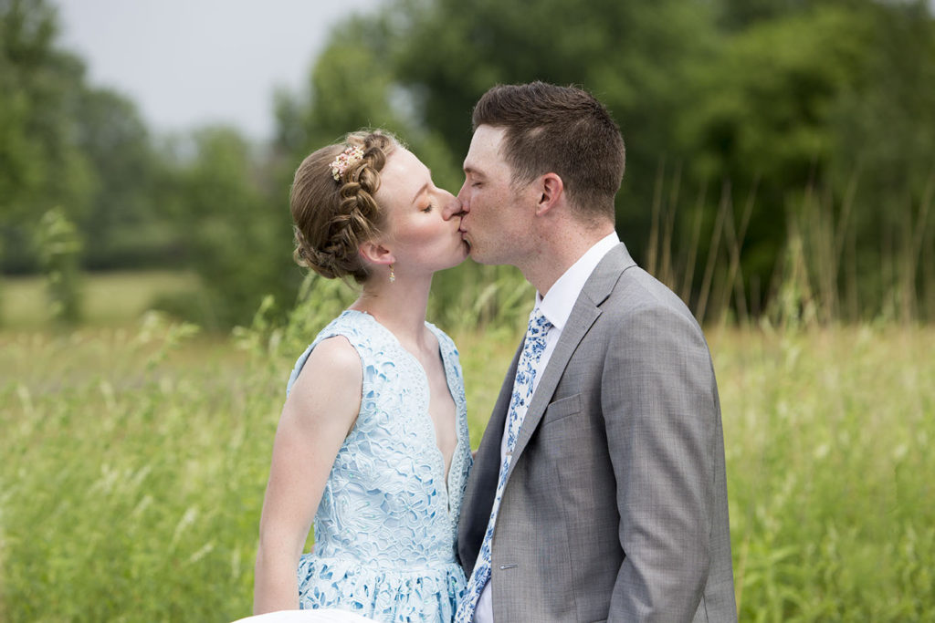 Ypsilanti wedding couple kissing at Conservancy Farms