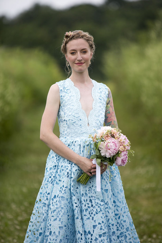 Rachel in her gorgeous light blue lace dress and pink peony bouquet after Ypsilanti wedding