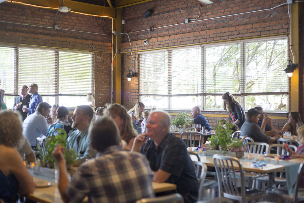 Guests wait for the arrival of Ypsilanti wedding couple at Corner Brewery