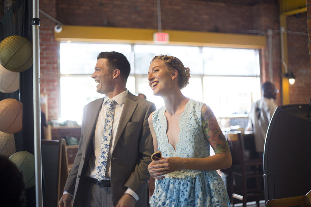 Ypsilanti wedding couple laughs as they enter Corner Brewery