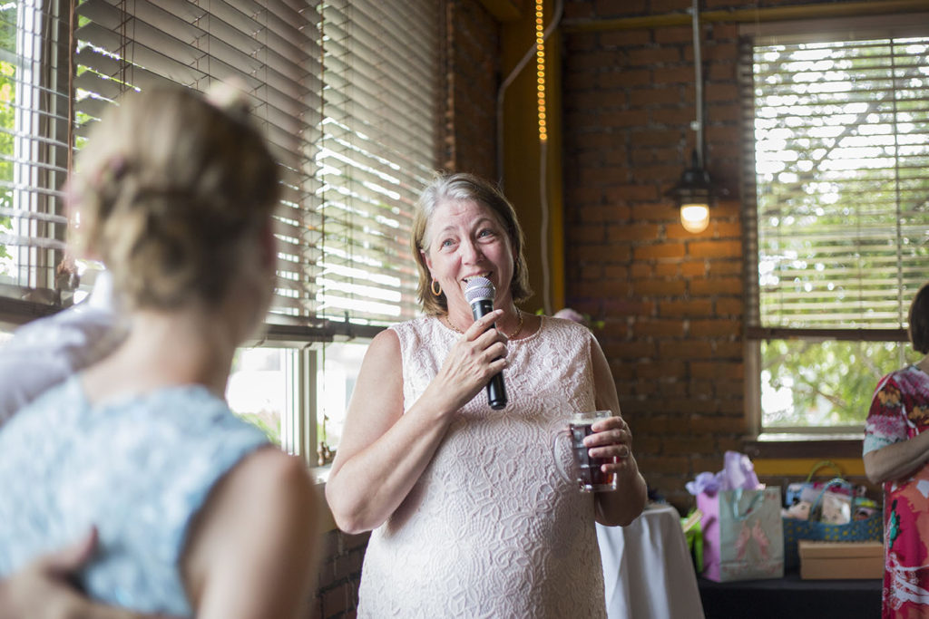 Mother of the groom speaks to couple at Ypsilanti wedding reception