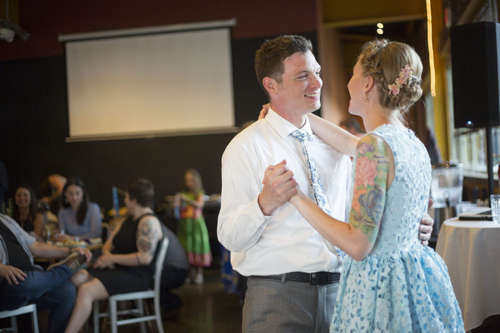 Ypsilanti wedding couple gaze at each other during first dance