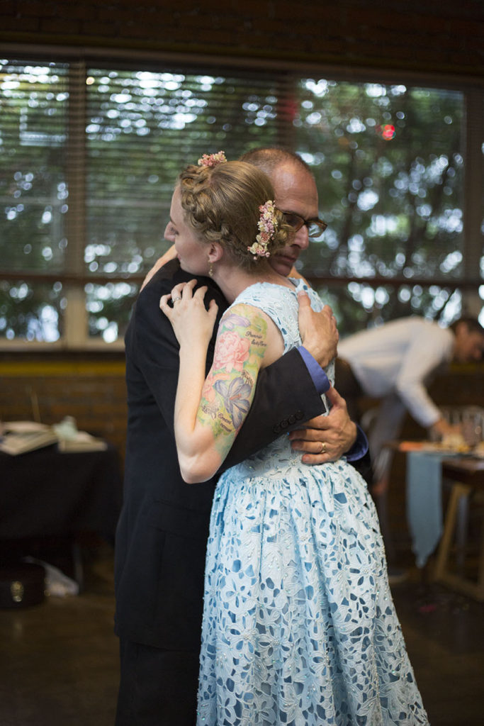 Father hugs daughter after Ypsilanti wedding dance